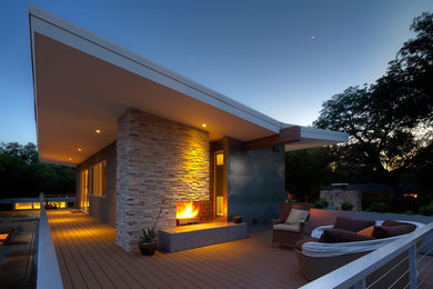 Inspiration for a gey modern house exterior in Austin with mixed cladding.