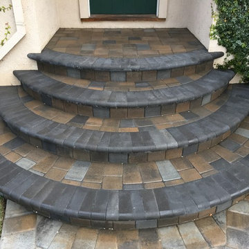 Concrete Radius Entry Staircase and Landing Overlaid with thin Pavers