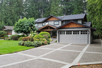 Mid-sized elegant gray two-story wood exterior home photo in Vancouver with a shingle roof
