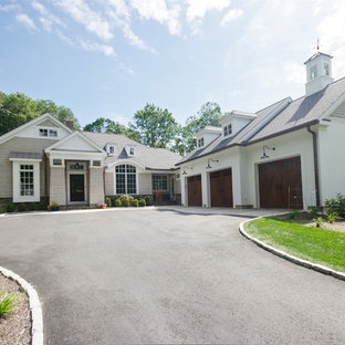 Example of a large farmhouse beige two-story mixed siding exterior home design in New York with a shingle roof