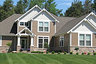 Example of an arts and crafts exterior home design in Cleveland
