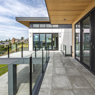 Example of a large trendy multicolored two-story mixed siding exterior home design in Seattle with a metal roof