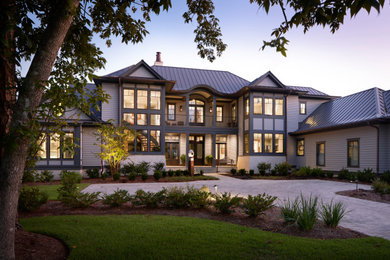 Large contemporary gray two-story wood house exterior idea in Atlanta with a metal roof
