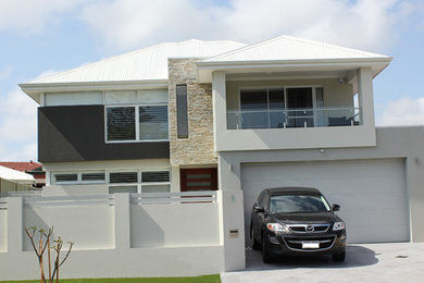 Design ideas for a medium sized modern house exterior in Perth.