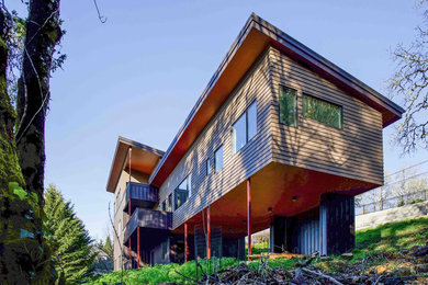 Contemporary brown three-story house exterior idea in Portland
