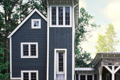 Inspiration for a large contemporary blue three-story mixed siding exterior home remodel in Detroit