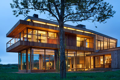 Inspiration for a contemporary wood exterior home remodel in Denver