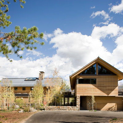 Example of a large minimalist brown two-story mixed siding exterior home design in Denver