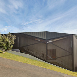 Modern grey exterior in Sydney with a metal roof.