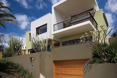 Foto della villa grande multicolore contemporanea a due piani con rivestimenti misti e tetto piano