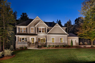 Huge elegant two-story mixed siding exterior home photo in Charlotte