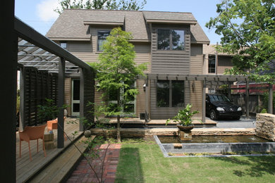 Inspiration for a craftsman brown two-story mixed siding exterior home remodel in Houston
