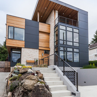 Large contemporary gray three-story mixed siding flat roof idea in Seattle