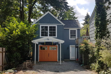 Inspiration for a small craftsman blue two-story concrete fiberboard exterior home remodel in Seattle with a shingle roof