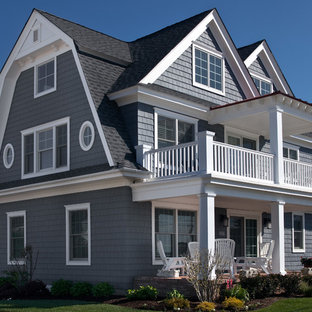 Example of a mid-sized beach style blue three-story wood gable roof design in Philadelphia