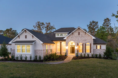 Inspiration for a large transitional one-story brick house exterior remodel in Jacksonville