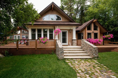 Inspiration for a mid-sized craftsman brown two-story wood exterior home remodel in Other with a shingle roof