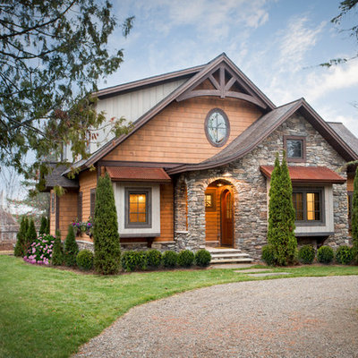 Mid-sized rustic multicolored two-story mixed siding exterior home idea in Other with a shingle roof