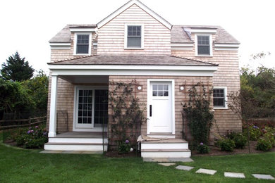 Mid-sized transitional beige two-story wood exterior home photo in Boston with a shingle roof