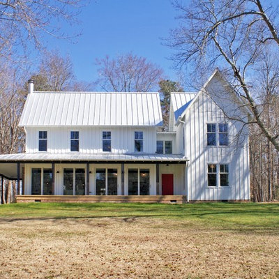 Farmhouse white two-story wood exterior home photo in Raleigh