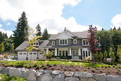 Transitional gray two-story wood exterior home photo in Vancouver