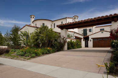 Large and white mediterranean two floor render house exterior in Orange County with a hip roof.