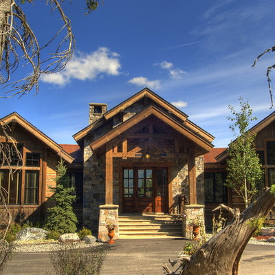 Example of a classic stone exterior home design in Other