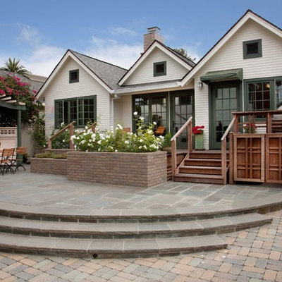 Small traditional white one-story wood exterior home idea in San Diego with a shingle roof