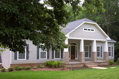 Large craftsman gray two-story concrete fiberboard exterior home idea in Birmingham with a hip roof