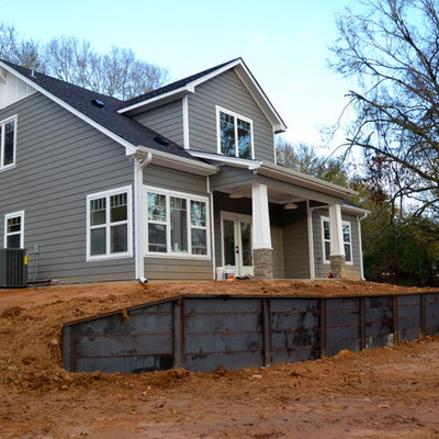 Mid-sized arts and crafts gray two-story mixed siding exterior home photo in Dallas with a clipped gable roof