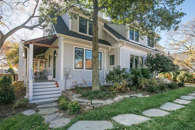 This is an example of a gey traditional house exterior in DC Metro with three floors.