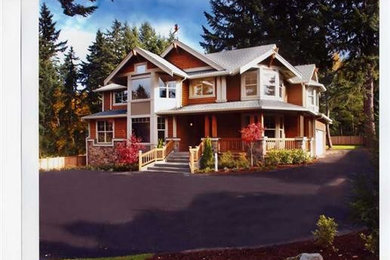 Inspiration for a large craftsman brown two-story wood gable roof remodel in New York