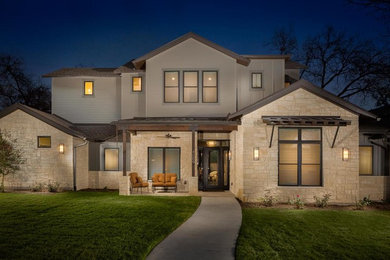 Large transitional multicolored two-story mixed siding exterior home idea in Austin