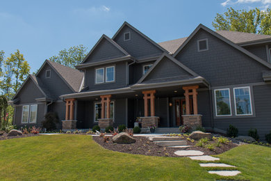 Large craftsman gray two-story concrete fiberboard gable roof idea in Milwaukee