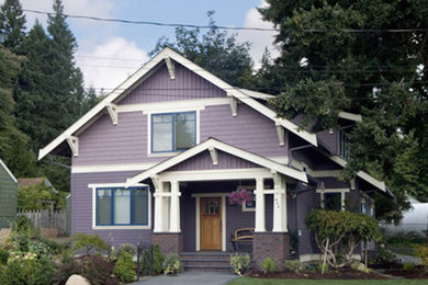 Inspiration for a craftsman split-level wood exterior home remodel in Seattle