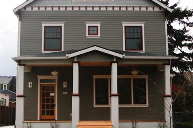 Inspiration for a large craftsman green three-story wood exterior home remodel in Portland