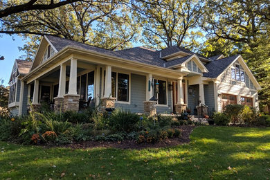 Design ideas for a blue and medium sized traditional two floor detached house in Chicago with mixed cladding, a pitched roof and a shingle roof.