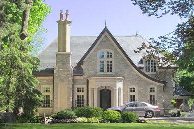 Large elegant beige two-story stone exterior home photo in Toronto with a shingle roof