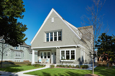 Elegant gray two-story wood gable roof photo in Minneapolis