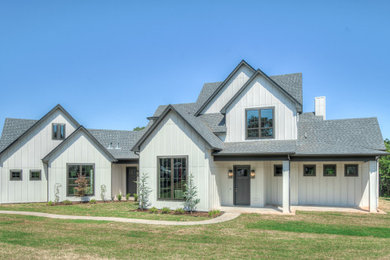Example of a farmhouse exterior home design in Houston