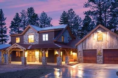 Large rustic brown two-story wood house exterior idea in Albuquerque with a hip roof and a mixed material roof
