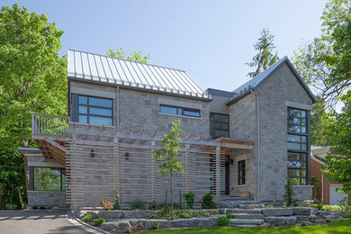 Example of a trendy gray two-story stone exterior home design in Ottawa