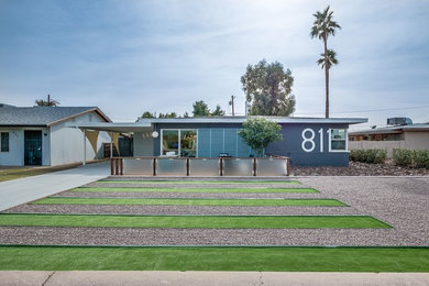 Mid-sized 1950s multicolored one-story mixed siding house exterior photo in Phoenix with a hip roof and a shingle roof