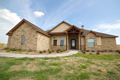 Mid-sized rustic brown one-story stone gable roof idea in Dallas