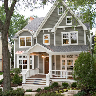 Example of a classic gray two-story wood gable roof design in Chicago