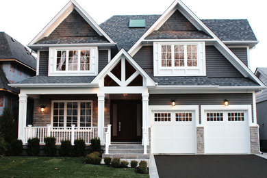 Inspiration for a craftsman blue wood exterior home remodel in Toronto