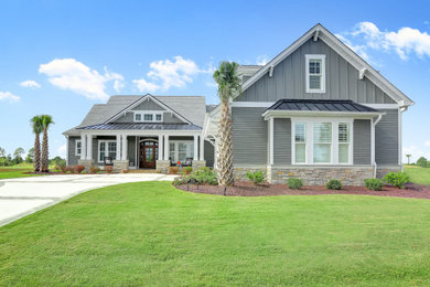Mid-sized coastal gray two-story mixed siding house exterior idea in Wilmington with a mixed material roof