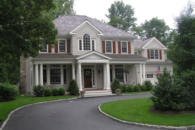 Gray two-story wood gable roof photo in New York