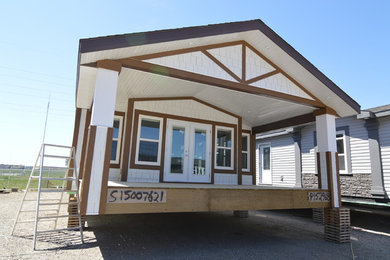 Mid-sized contemporary white one-story concrete fiberboard exterior home idea in Calgary