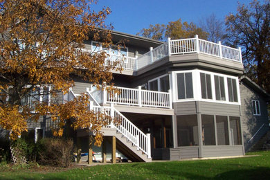 Example of a large trendy gray three-story wood exterior home design in Portland